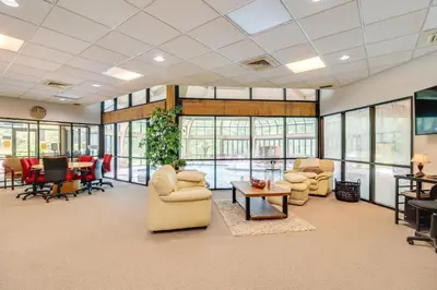 a living room with furniture and a dining room at Community Indoor Pool Tannersville Townhome in Tannersville