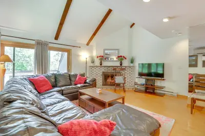 a living room with a couch and a tv at Community Indoor Pool Tannersville Townhome in Tannersville
