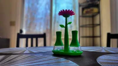 three green vases sitting on a table with a flower at Pocono House in a private community 4 pools, Lake. in Tobyhanna