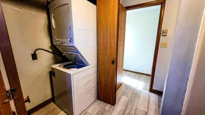 a kitchen with a tv on top of a washing machine at Pocono House in a private community 4 pools, Lake. in Tobyhanna