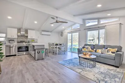 a large living room with a couch and a kitchen at Game Room! Tobyhanna Retreat 17 Mi to Ski Slopes in Tobyhanna
