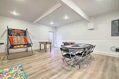 a room with a ping pong table and a table at Community Beach and Lake Pocono Summit Escape in Pocono Summit