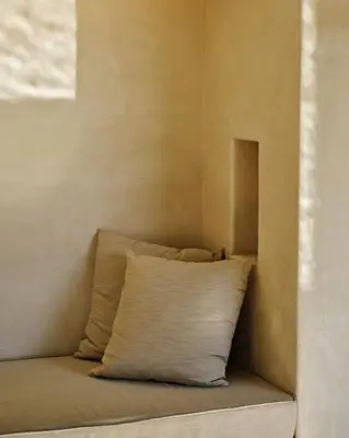 a pillow sitting on a bed in a room at Inness in Accord