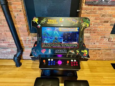 a video game machine sitting in a room at Brick City Loft in Newark