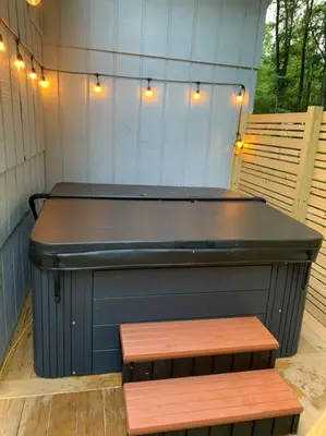 a ping pong table with two benches and lights at Modern Home near Lake w HotTub, Game Room, Fireplace in Albrightsville