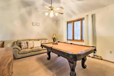 a living room with a pool table and a couch at Near Big Boulder Mtn Cabin with Furnished Deck in Albrightsville