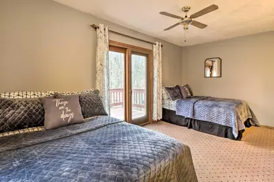 a bedroom with two beds and a window at Near Big Boulder Mtn Cabin with Furnished Deck in Albrightsville