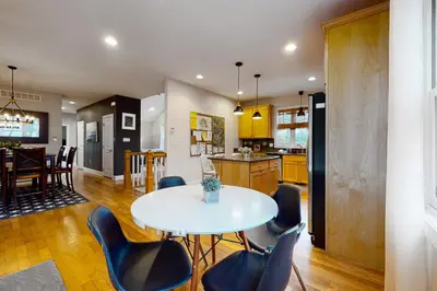 a kitchen and dining room with a table and chairs at 6 Fieldstone Ct in Lake Harmony