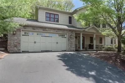 a house with two garage doors and a driveway at 6 Fieldstone Ct in Lake Harmony