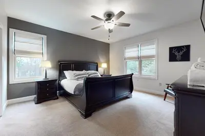a bedroom with a bed and a ceiling fan at 6 Fieldstone Ct in Lake Harmony