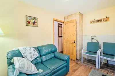 a living room with a couch and a table at Cozy Tannersville Gem - Ski, Hike, Explore! in Tannersville