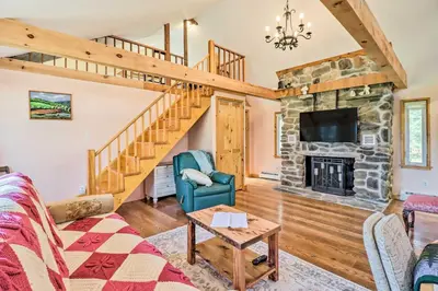 a living room with a couch and a fireplace at Cozy Tannersville Gem - Ski, Hike, Explore! in Tannersville