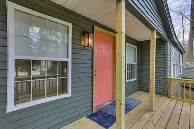 a front door of a house with a red door at Kayaks, Electric Bicycles Greentown Hideaway! in Greentown