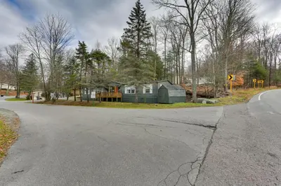 a house sitting on the side of a road at Kayaks, Electric Bicycles Greentown Hideaway! in Greentown