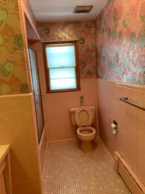 a bathroom with a toilet and a window at #3 QueenSize Bed bright room near New Brunswick NJ downtown in New Brunswick