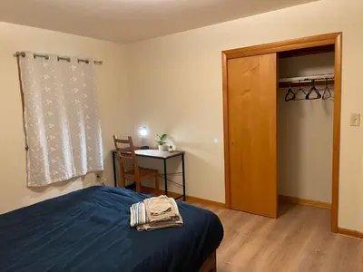 a bedroom with a bed and a table and a window at #3 QueenSize Bed bright room near New Brunswick NJ downtown in New Brunswick
