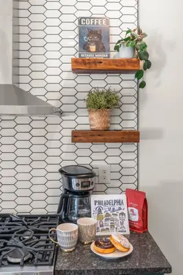 a counter with a coffee pot and plates of food at Family Fun South Philly Game House Near Sports Stadiums and Concerts in Philadelphia