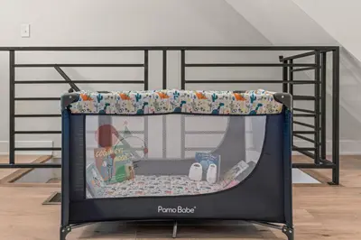 a toy crib with a table in a room at Family Fun South Philly Game House Near Sports Stadiums and Concerts in Philadelphia