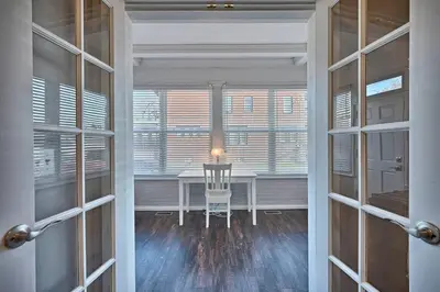 a dining room with a table and a window at Suites on Seneca - Lovely 2 Bed 1 Bath Apartment in Harrisburg