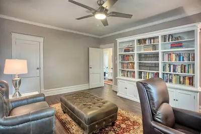 a living room with two chairs and a ceiling fan at Suites on Seneca - Beautiful 1 Bedroom Apartment in Harrisburg