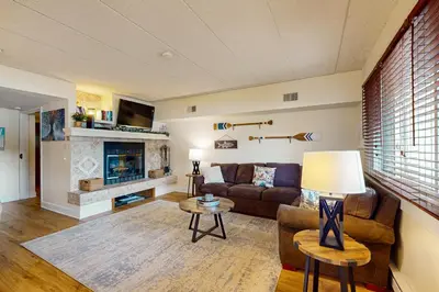 a living room with a couch and a fireplace at Midlake Memories in Lake Harmony
