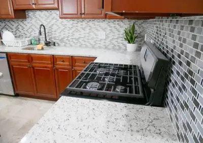 a kitchen with a stove top oven in a kitchen at Newly Renovated Guest Rooms near Transportation in Philadelphia