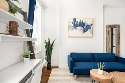 a living room with a blue couch at 69-2B Prime Lower East East BRAND NEW 1br Apt in New York