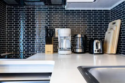 a kitchen counter with a coffee maker on it at 69-3C Stylish Lower East East 1br Apt BRAND NEW in New York