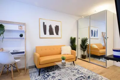 a living room with a couch and a glass table at 69-3D Prime Lower East East BRAND NEW 1br Apt in New York