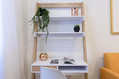a desk in a room with a shelf at 69-3D Prime Lower East East BRAND NEW 1br Apt in New York