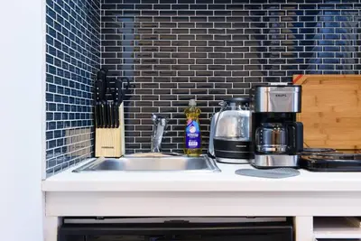 a kitchen counter with a sink and a coffee maker at 69-4B Modern Lower East Side 1BR PRIME LOCATION in New York