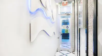a door to a store with a sign on the wall at 24-3 Prime Gramercy New Studio W D Terrace in New York