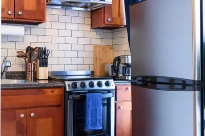 a kitchen with a stove and a refrigerator at 69-5D Modern Lower East East 1br Apt BRAND NEW in New York