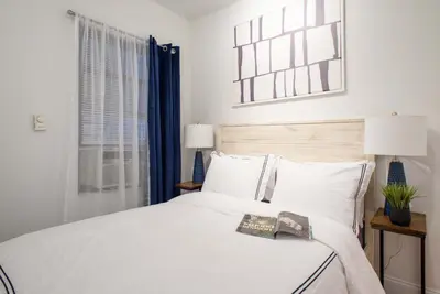 a bedroom with a white bed and a window at 69-5D Modern Lower East East 1br Apt BRAND NEW in New York