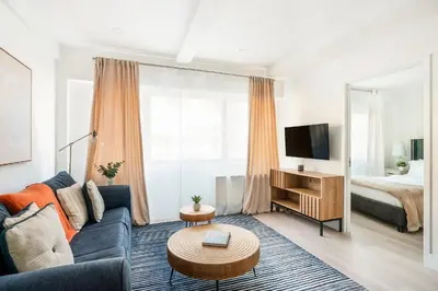 a living room with a couch and a bed at 809-2A Gorgeous 1BR New W D Modern Best Location in New York