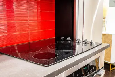 a kitchen with a red window and a stove at 809-3B Columbus Circle W D new BLDG Balcony in New York