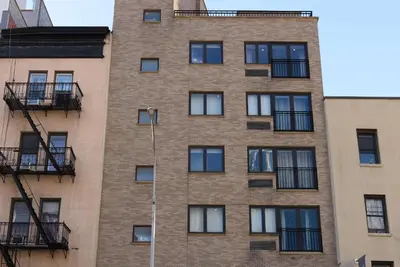 a tall brick building with windows and balconies at 809-4A Columbus Circle New BLDG 1BR W D in New York