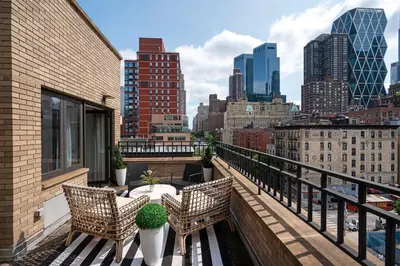 a balcony with a view of a city skyline at 809-6A NEW 2BR Private Roof & City View in New York