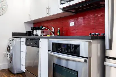a kitchen with a sink and a dishwasher at 809-6B 2BR Duplex Breathtaking Views Beauty in New York