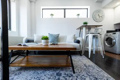 a living room with a couch and a table at 809-6B 2BR Duplex Breathtaking Views Beauty in New York