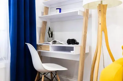 a room with a chair and a desk and a lamp at 69-2D Stylish Lower East Side 1BR Apt BRAND NEW in New York