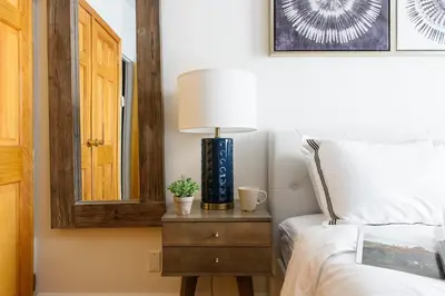 a bedroom with a bed and a lamp on a nightstand at 26-4B Newly Furnished 1BR W D Courtyard in New York