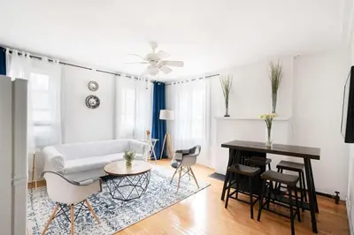 a living room with a couch and a table at 11-4F Prime west village designer 1BR in New York