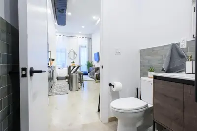 a bathroom with a white toilet and a sink at 3-1 New Prime East Village Private Terrace in New York