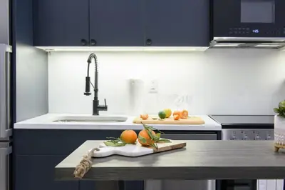 a kitchen with a counter with fruits and vegetables on it at 3-1 New Prime East Village Private Terrace in New York