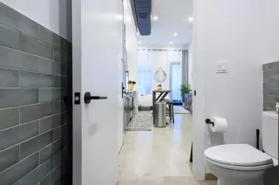 a bathroom with a white toilet and a sink at 3-1 New Prime East Village Private Terrace in New York