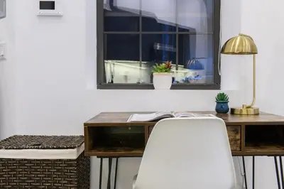 a desk with a chair in front of a window at 3-2 NEW Prime E Village Private outdoor! in New York