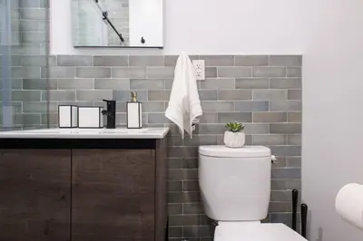 a bathroom with a toilet and a sink at 3-2 NEW Prime E Village Private outdoor! in New York