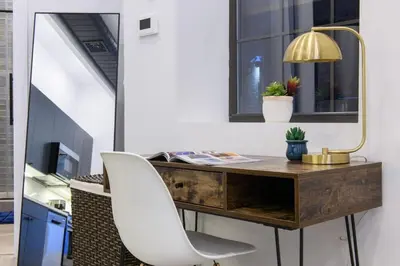 an office with a desk and a white chair at 3-2 NEW Prime E Village Private outdoor! in New York