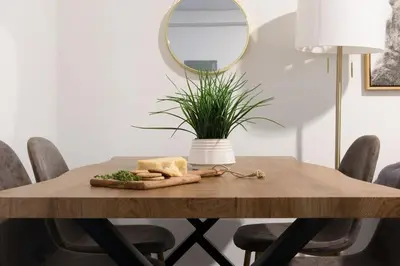 a table with a plate of cheese and a mirror at 39-1 Renovated 3BR Prime Midtown West in New York